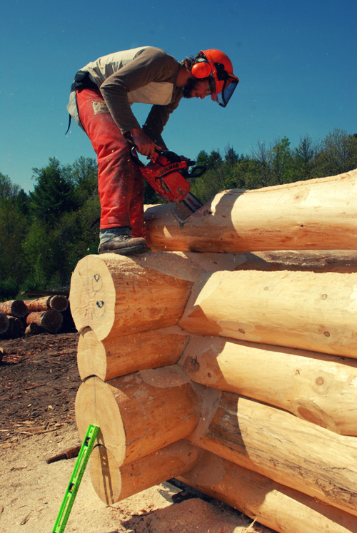 James Notching a log